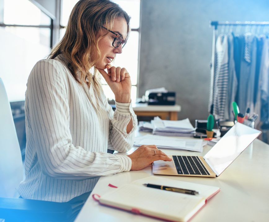 Business owner reading about CloudConnect's NetSuite eCommerce Integrations.